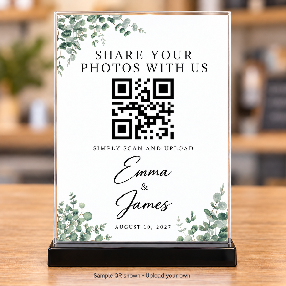 Eucalyptus wedding photo-sharing QR sign with personalized names and date in a clear 5x7 holder with black base