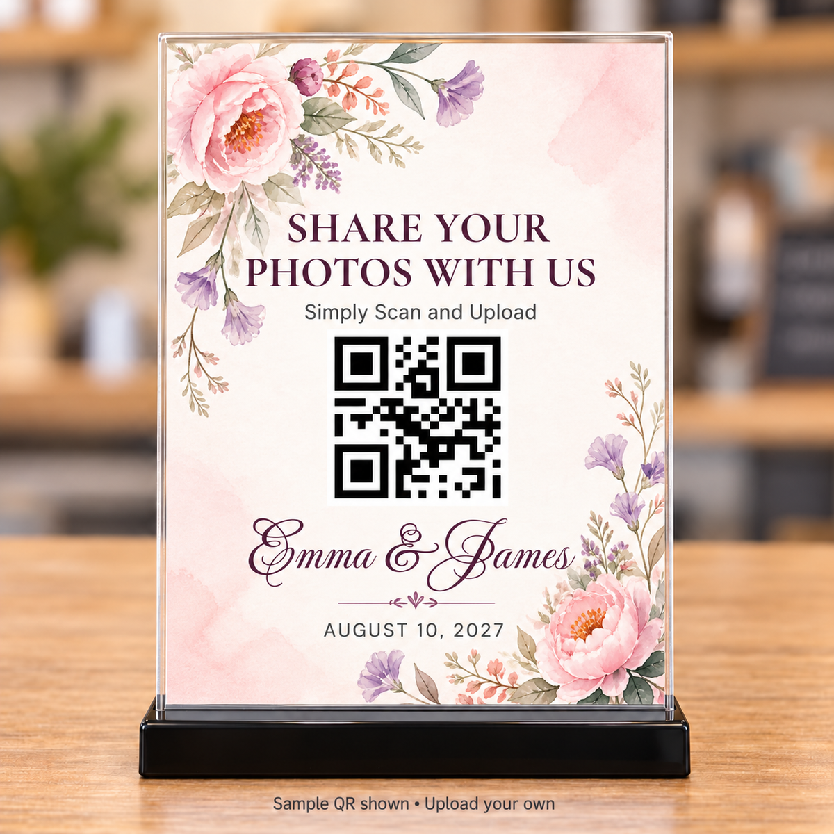 Pink peony wedding photo-sharing QR code sign with plum lettering in a clear 5x7 holder and black base
