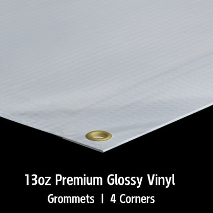 Close-up of a custom vinyl banner by Phoenix Print Shop, highlighting detailed printing, reinforced edges, and durable grommets