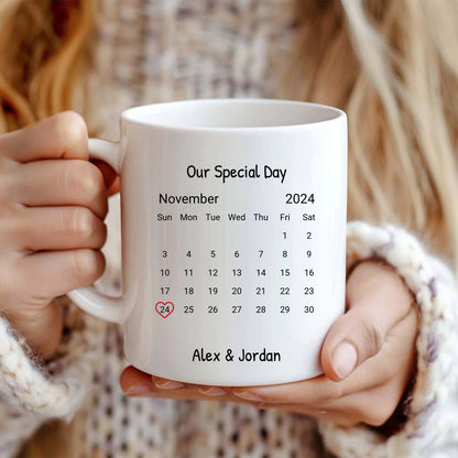 11 oz personalized couple mug with a heart-marked calendar and custom names