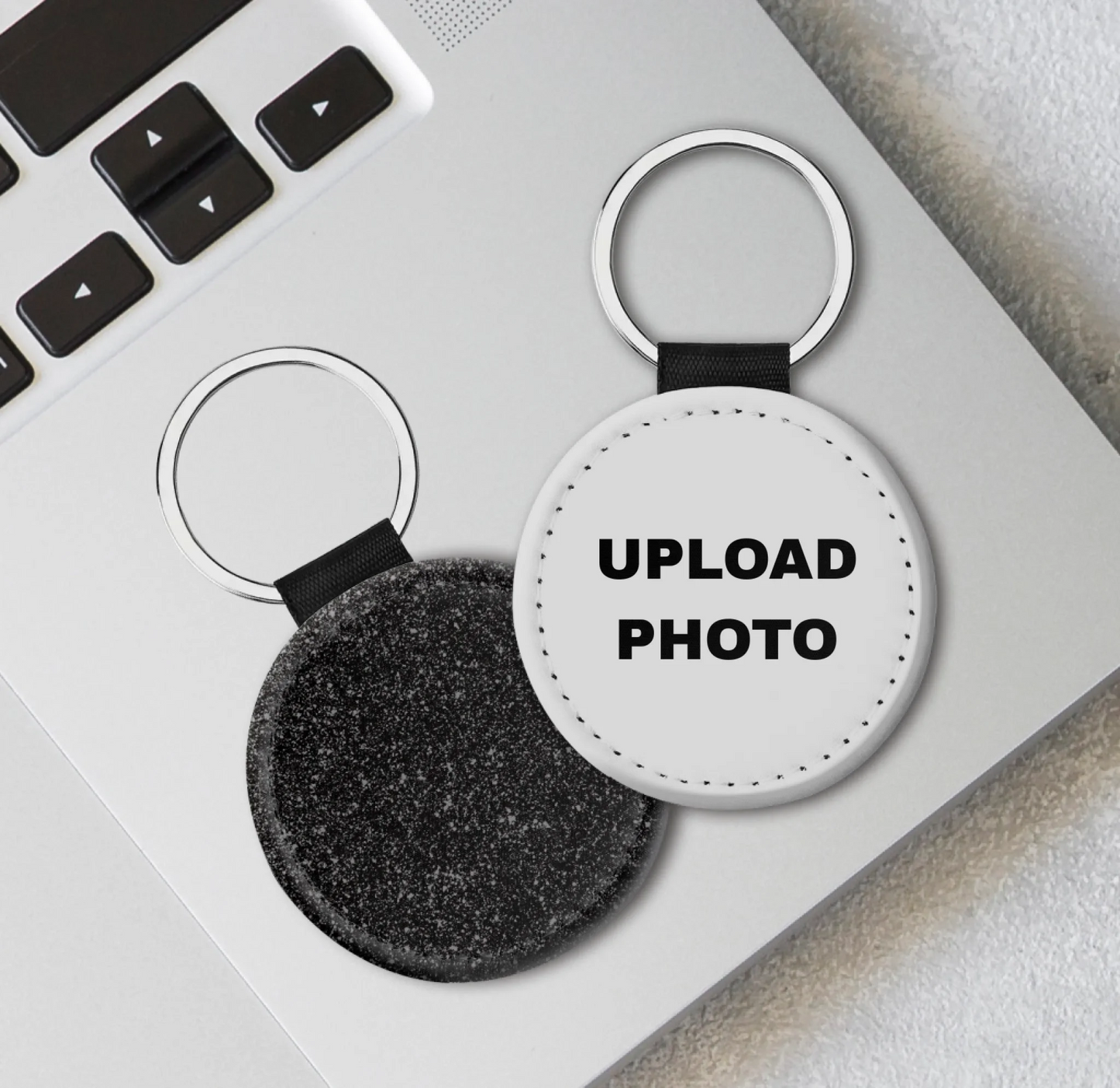 Black glitter PU leather circle keychain personalized with full-color logos, photos, names, and custom artwork.