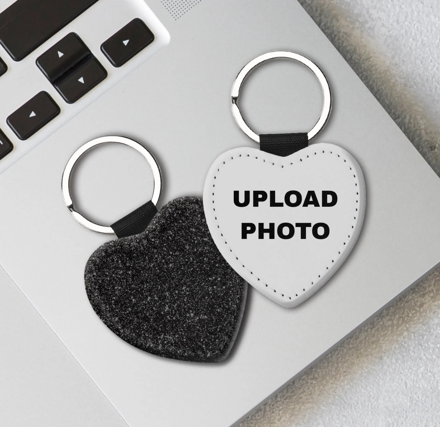 Black glitter heart PU leather keychain personalized with photos, logos, names, and artwork using full-color sublimation printing.
