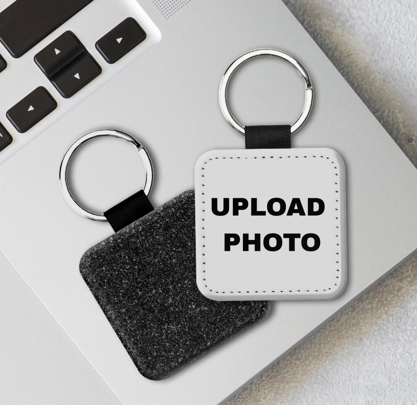Black glitter square PU leather keychain personalized with photos, logos, names, and artwork using full-color sublimation printing.