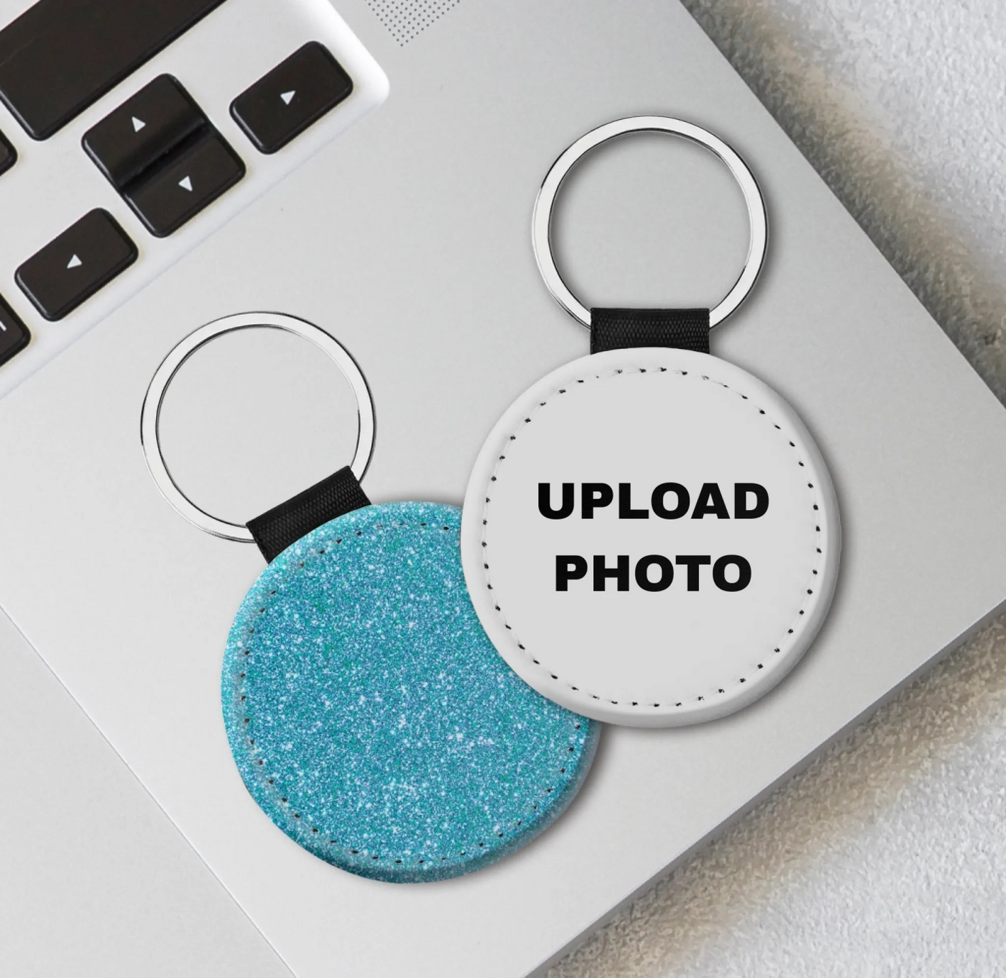 Blue glitter PU leather circle keychain customized with vibrant sublimation printing for logos, photos, and personalized designs.