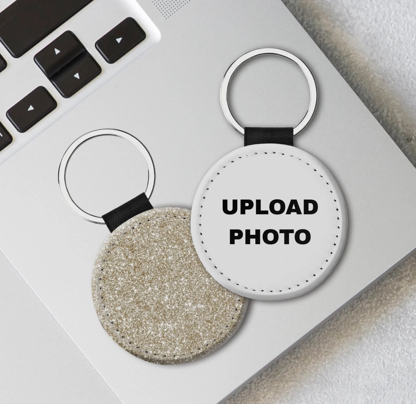 Gold glitter circle leather keychain customized with full-color photos, logos, names, and artwork.