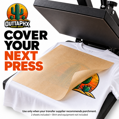 Parchment cover sheet over a cactus print on a white T-shirt in an open heat press.