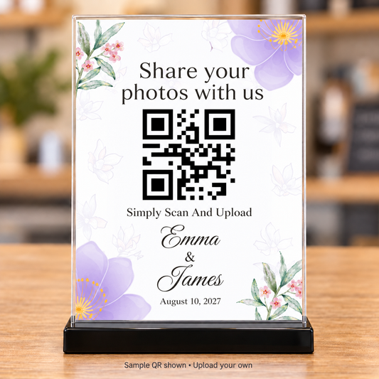 Purple floral wedding photo-sharing QR sign with personalized names and date in a clear 5x7 holder with black base