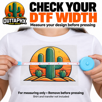Light blue retractable measuring tape checking the width of a cactus DTF transfer on a T-shirt.
