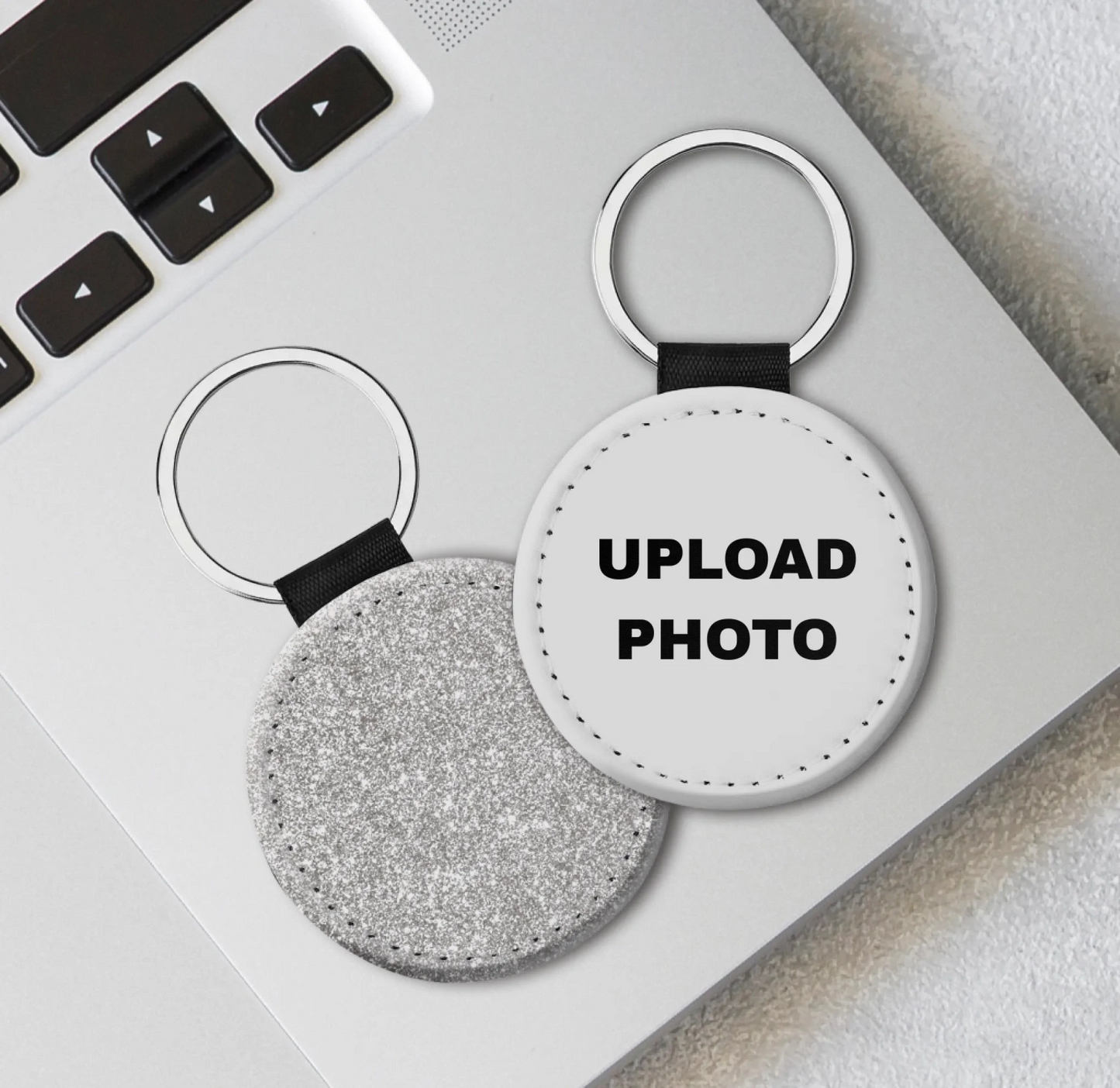 Silver glitter circle leather keychain personalized with photos, logos, names, and artwork.