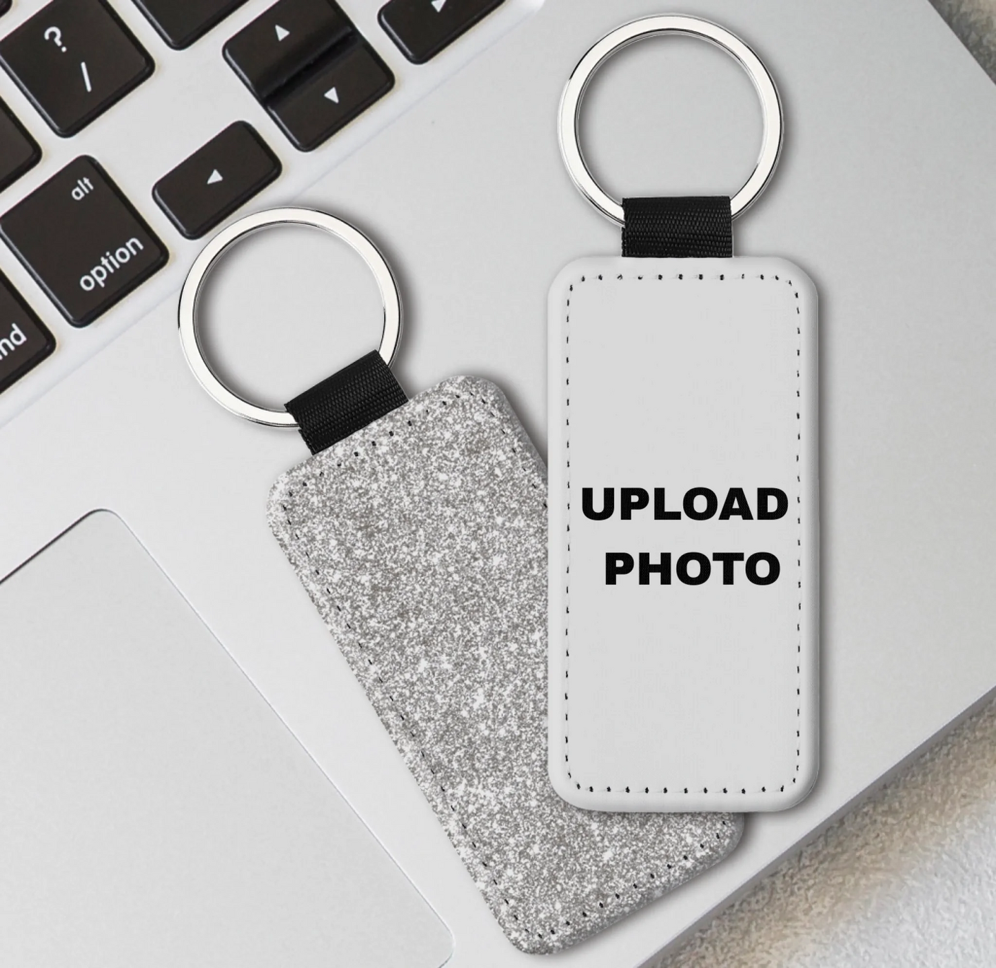 Silver glitter rectangle PU leather keychain personalized with logos, photos, names, and artwork.