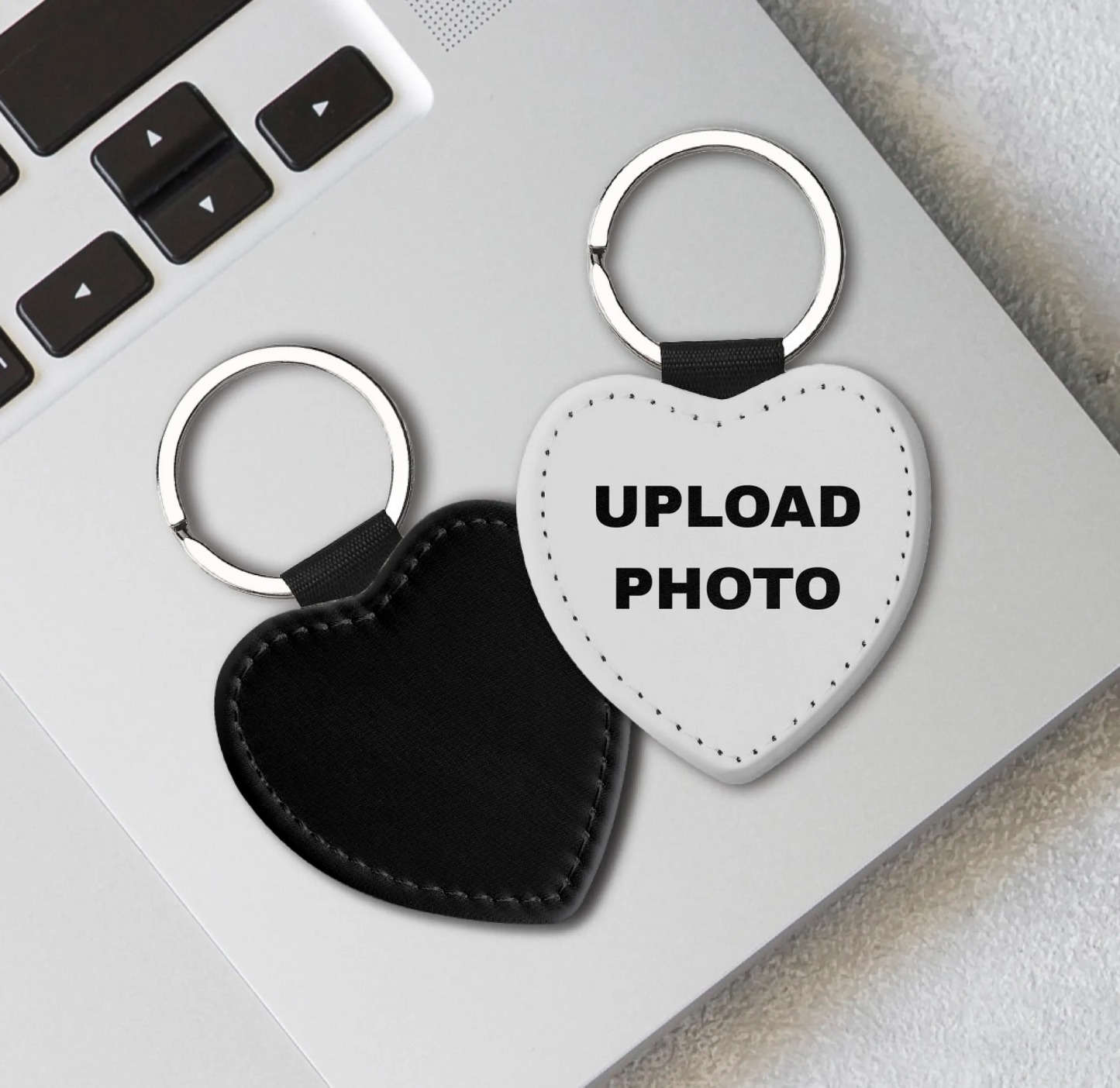 Solid black PU leather heart keychain personalized with photos, logos, names, and custom artwork.